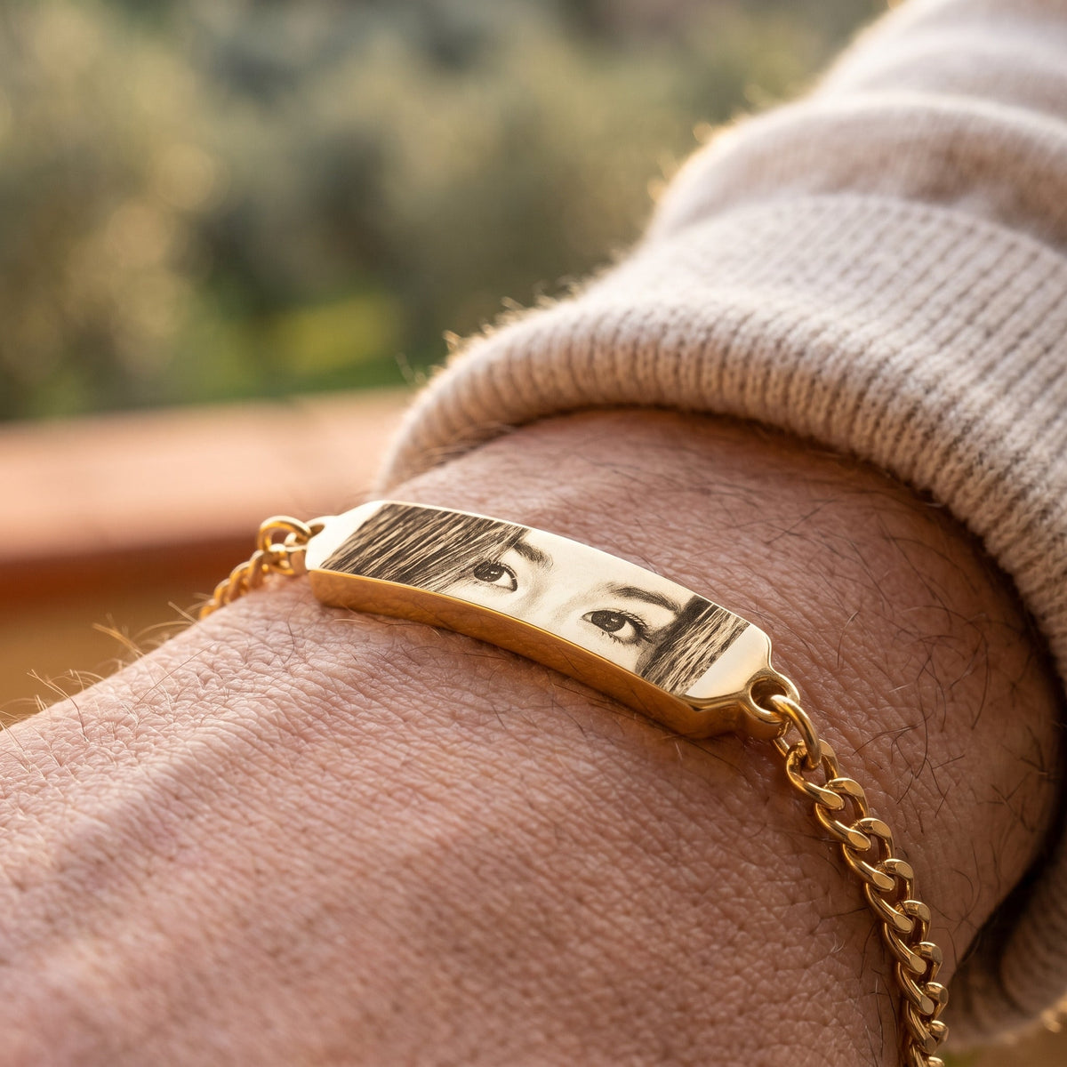 Gold eye bracelet worn on the wrist